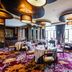 Chateau Star River Beijing dining room in Beijing with round tables, large windows, and patterned carpet
