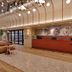 City Lodge Hotel Victoria and Alfred Waterfront reception with curved seating and hanging lights in Cape Town