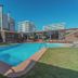 Hotel Canto del Mar in La Serena with outdoor pool and sun loungers