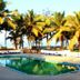 Calangute Residency in Calangute with palm trees and a rectangular outdoor pool near the beach