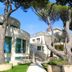 Hotel Terme Marine Leopoldo II in Grosseto, exterior with pine trees and garden walkway