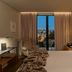Memmo Principe Real Lisbon guest room with king bed, balcony doors and city view