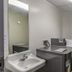 Motel 6 Augusta Ks laundry room with washer, dryer, sink and folding table in Augusta
