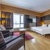 Radisson Blu Resort, Trysil guest room with twin beds, lounge chair, TV and large window