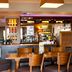 Premier Inn Edinburgh Park - Airport bar and dining area in Edinburgh with wooden tables and chairs