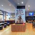 ibis Styles Saint-Malo Centre Historique lounge bar with stools, seating, and bold wall art