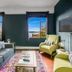 The Oxford at Pike Place Market, Seattle: lounge with sofa, armchairs, TV and windows with water view
