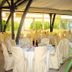 Villaggio Della Salute Più in Monterenzio: banquet hall with round tables and covered chairs