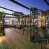 Moxy Seoul Insadong rooftop terrace in Seoul with city views, seating, and greenery at dusk