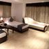 The Grand Radiant Hotel in Lucknow room with two beds, chaise lounge, and coffee table