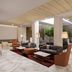 abba Sevilla lobby lounge in Seville with marble floors, sofas, dining tables and indoor greenery