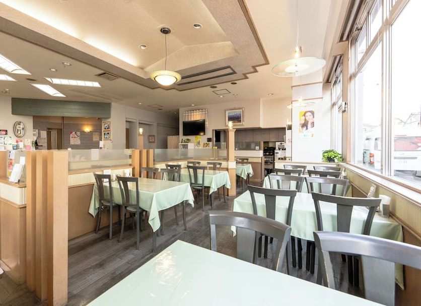 Tendo Central Hotel in Tendō dining area with tables and chairs by large windows
