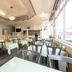 Tendo Central Hotel in Tendō dining area with tables and chairs by large windows