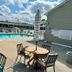 Sea Girt Lodge in Sea Girt outdoor pool with lounge chairs and striped umbrellas
