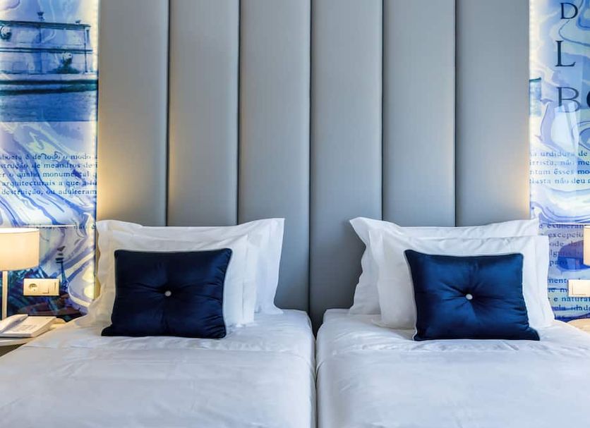 Lisbon Sao Bento Hotel in Lisbon, twin beds with navy pillows and blue patterned wall panels