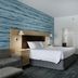 TownePlace Suites by Marriott Savannah Airport guest room with king bed, desk, and seating area