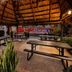 Super 8 by Wyndham Florida City/Gateway to Keys/Everglades patio with thatched roof and picnic tables