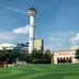 Hotel Nyland Pasteur Bandung in Bandung with mosque, tower, and green lawn under blue sky