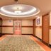 The Grand Plaza Hotel Smouha in Alexandria hallway with ornate ceiling and patterned carpet