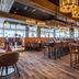Radisson Blu Resort, Trysil restaurant dining room with tables, chairs and pendant lights in Innbygda
