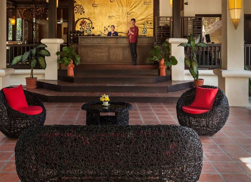 Lanna Dusita Riverside Boutique Resort in Chiang Mai lobby with wicker seating and front desk