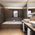 Áurea Toledo by Eurostars Hotel company bathroom with double sink, bathtub and window view in Toledo