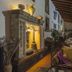 Villa dei Papiri in Siracusa: elegant indoor lounge with carved stone fireplace and seating