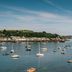 Greenbank Hotel in Falmouth overlooking a harbor with sailboats and a waterfront shoreline