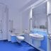 Travelodge Hull Central accessible bathroom with roll-in shower, toilet, sink and grab bars in Hull