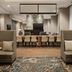 Residence Inn By Marriott New York Jfk Airport in Queens lobby seating area with dining tables and stone fireplace