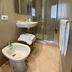 Villa Santacroce bathroom in San Giovanni Rotondo with shower stall, bidet, sink and towel rack