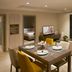 Somerset Rama 9 Bangkok suite with dining table, living area, bedroom view and city-facing windows