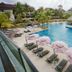 Sand & Sandals Desaru Beach Resort & Spa in Bandar Penawar, tropical lagoon pool with lounge chairs and umbrellas