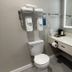 Days Inn by Wyndham Jefferson City bathroom with toilet, sink vanity, mirror, towels and toiletries