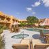 Best Western Gold Canyon Inn & Suites pool courtyard with hot tub, lounge chairs and umbrellas in Gold Canyon