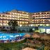 Cerro Mar Atlantico & Cerro Mar Garden in Albufeira with lit outdoor pool and sun loungers at night