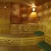 Bella Hotel Istanbul sauna room with wooden benches and green cushions