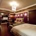 Wego Hotel - Linsen, Taipei City suite with bed, sofa seating and ornate purple wall panels