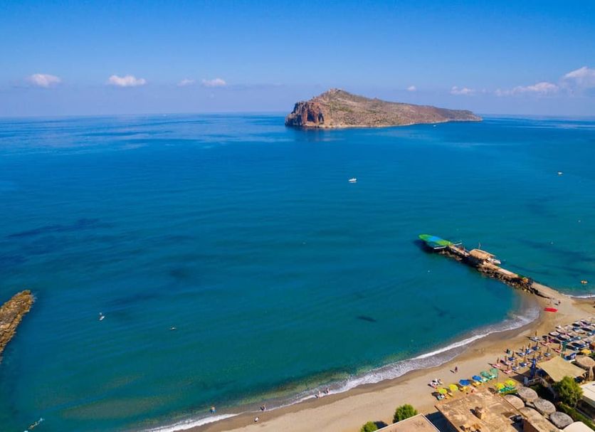 Solimar Turquoise - Adults Only in Chania overlooks a turquoise sea with a rocky island and sandy beach