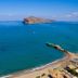Solimar Turquoise - Adults Only in Chania overlooks a turquoise sea with a rocky island and sandy beach
