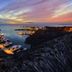 The Bannister Hotel in Samaná overlooking a marina at sunset with yachts and calm water