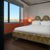 The July - Boat & Co in Amsterdam guest room with double bed, city view window, and warm bedside lamps