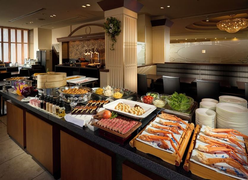 Hotel Resol Gifu breakfast buffet with assorted dishes and tableware in a dining area in Gifu