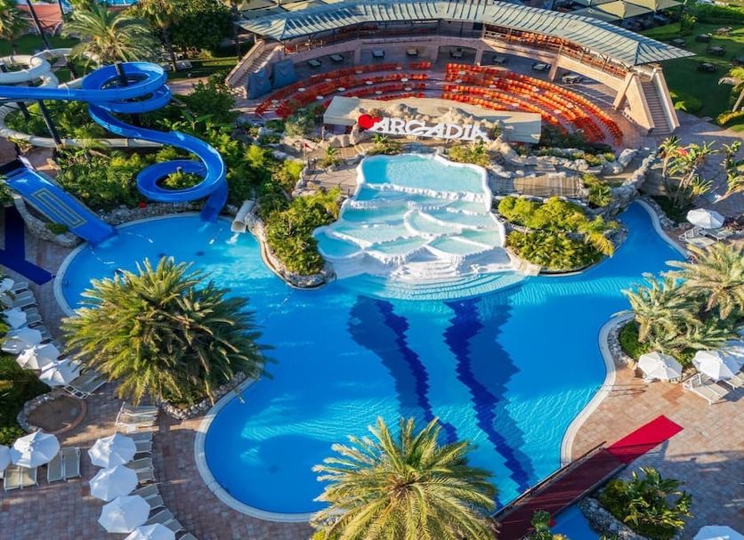 Limak Arcadia Golf & Sport Resort in Belek with a large lagoon pool and blue waterslides