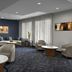 Courtyard by Marriott Greensboro Airport lobby with seating area and front desk in Greensboro