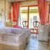Stone Hill Boutique in Ayvalik: bright guest room with double bed, balcony doors, and chairs