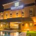 Road Lodge Bloemfontein Airport exterior at night with pool and patio in Bloemfontein