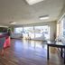 HomeTowne Studios by Red Roof Denver - Lakewood West lobby lounge with large windows and wood flooring
