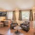Hotel Engel in Sasbachwalden lounge with two armchairs, desk, TV, and windows