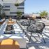 Luma Hotel San Francisco rooftop terrace with lounge seating, tables, and city views in San Francisco